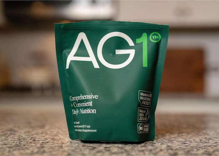 AG1 is a greens powder containing vitamins, minerals, superfoods, antioxidants, enzymes, therapeutic mushrooms, prebiotics and probiotics.